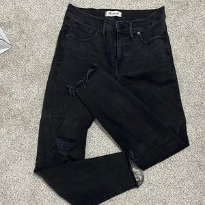 Madewell 9” Skinny. 28s faded black with frayed bottoms and ripped knees.